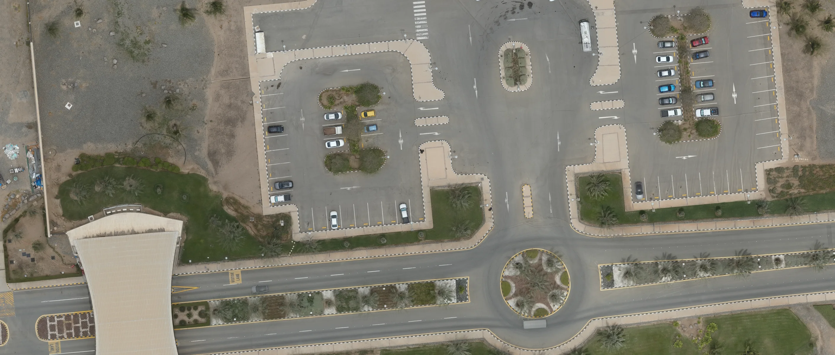 Annotated aerial survey output: an AI model has automatically outlined every parking bay, vehicle and boundary on a real drone orthomosaic.